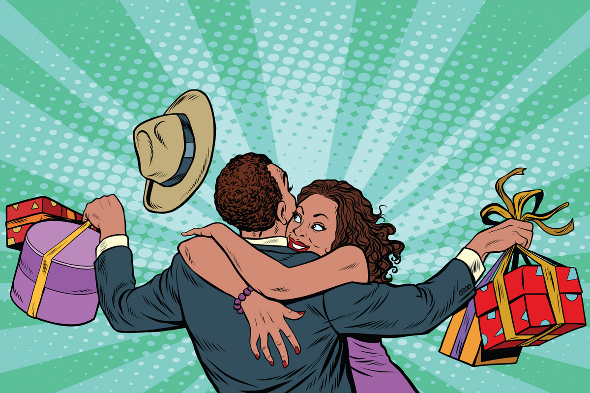 A woman hugging a man who carries a lot of gifts.