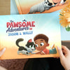 Woman holding a book for  child and his pet with custom characters.