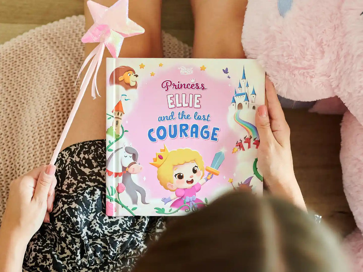A girl is holding the new personalized book about a princess who found her courage.