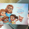 Woman holding the personalized book for father and three children by Hooray Heroes.