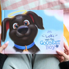 Personalized dog memorial book titled 'Loki Was the Goodest Boy' by Hooray Heroes, held by a pet owner.