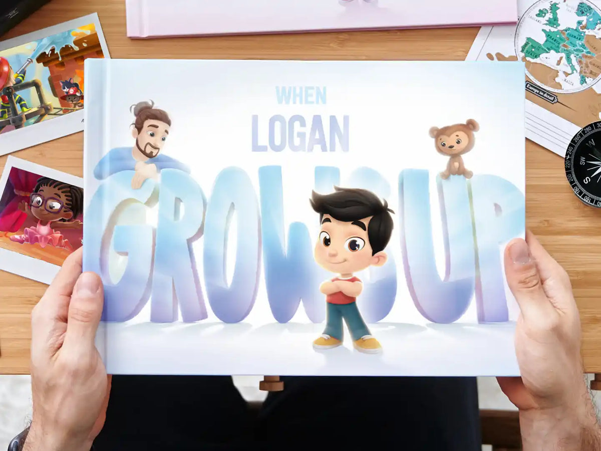 A father holding his personalized book When Logan Grows Up by Hooray Heroes.
