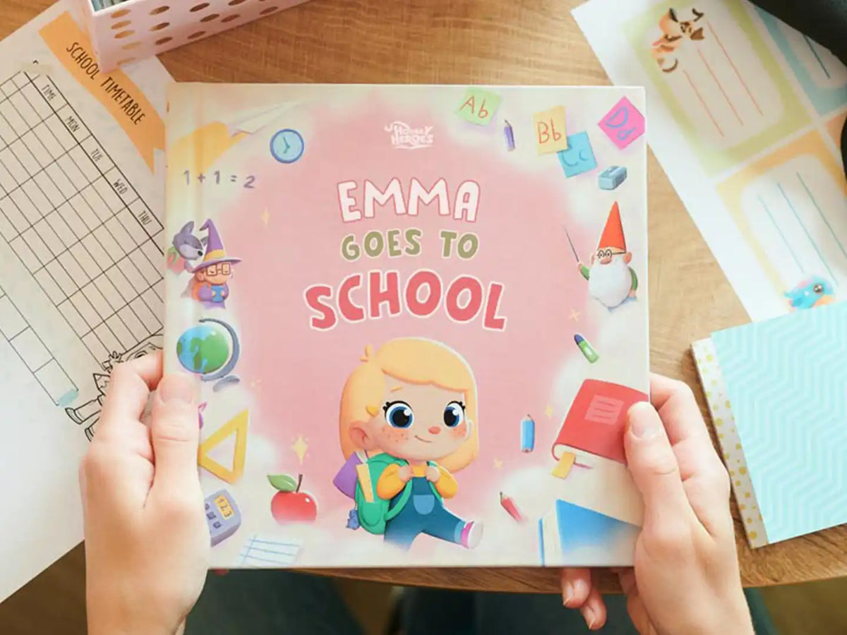 Girl holding a personalized for going back to school by Hooray Heroes.