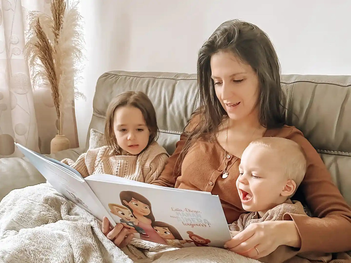 Mother and her two kids are reading a custom storybook in bed.