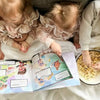 Kids eating popcorn and are enjoying this personalized book for brothers and sisters.