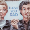 A father and his daughter having a fun moment of complicity with the cover of the best gift idea for dad: a personalized book for Father's day.