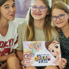 3 little girls holding their personalized story book for children, a lovely gift for Birthday or Christmas.