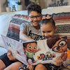 Siblings read their custom treasure hunt book together, the perfect gift for friends, cousins or brothers and sisters.