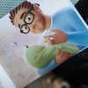 Sweet illustration of dad holding his bundle of joy from our custom book for dad and kids.