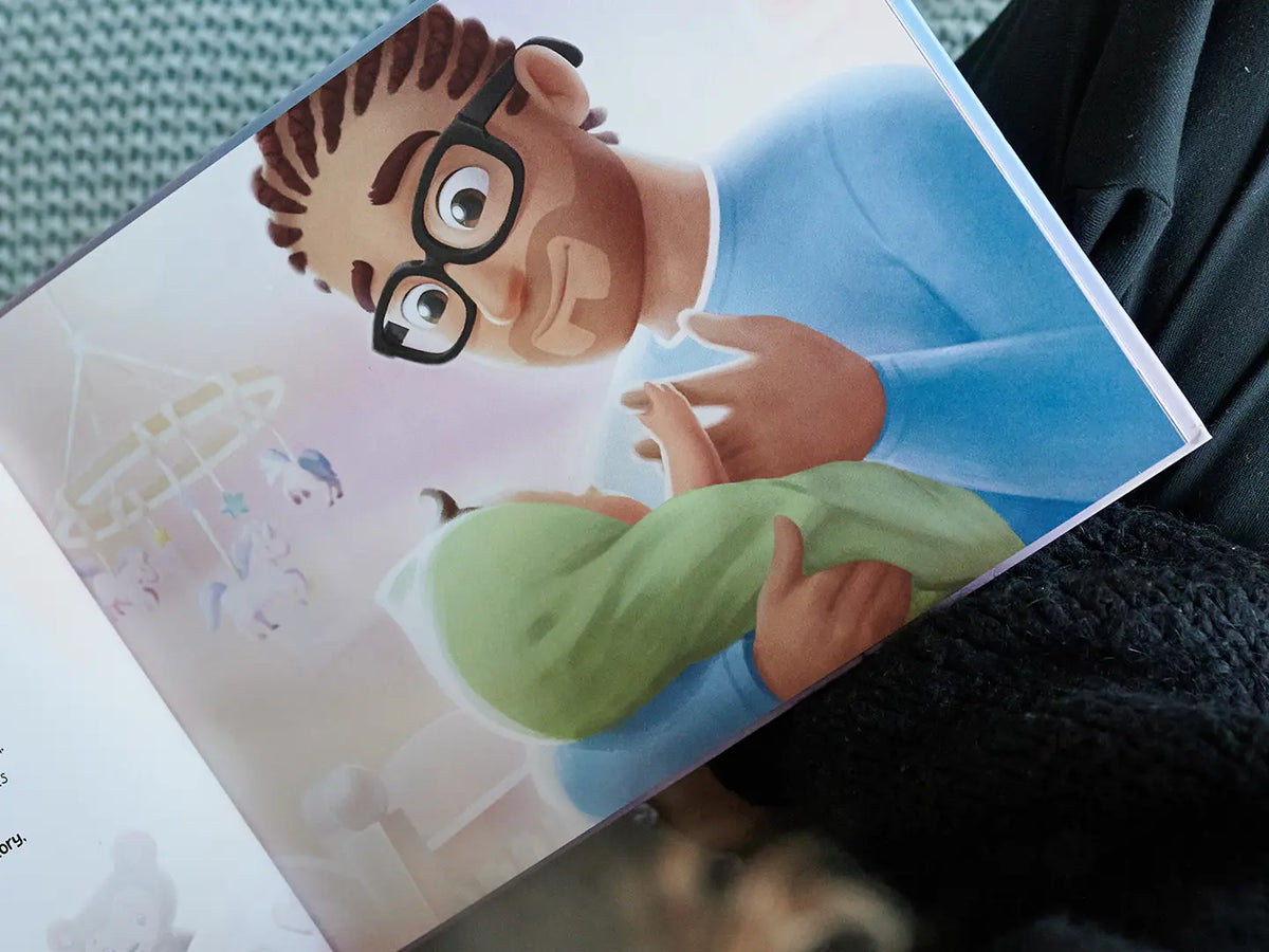 Sweet illustration of dad holding his bundle of joy from our custom book for dad and kids.