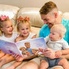 Happiness on the faces of dad and his kids when they open a Hooray Heores' personalized book for dad.