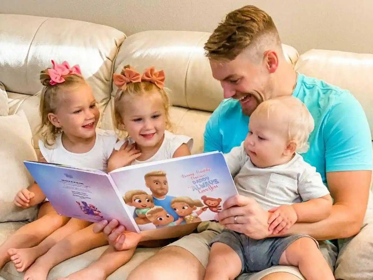 Happiness on the faces of dad and his kids when they open a Hooray Heores' personalized book for dad.