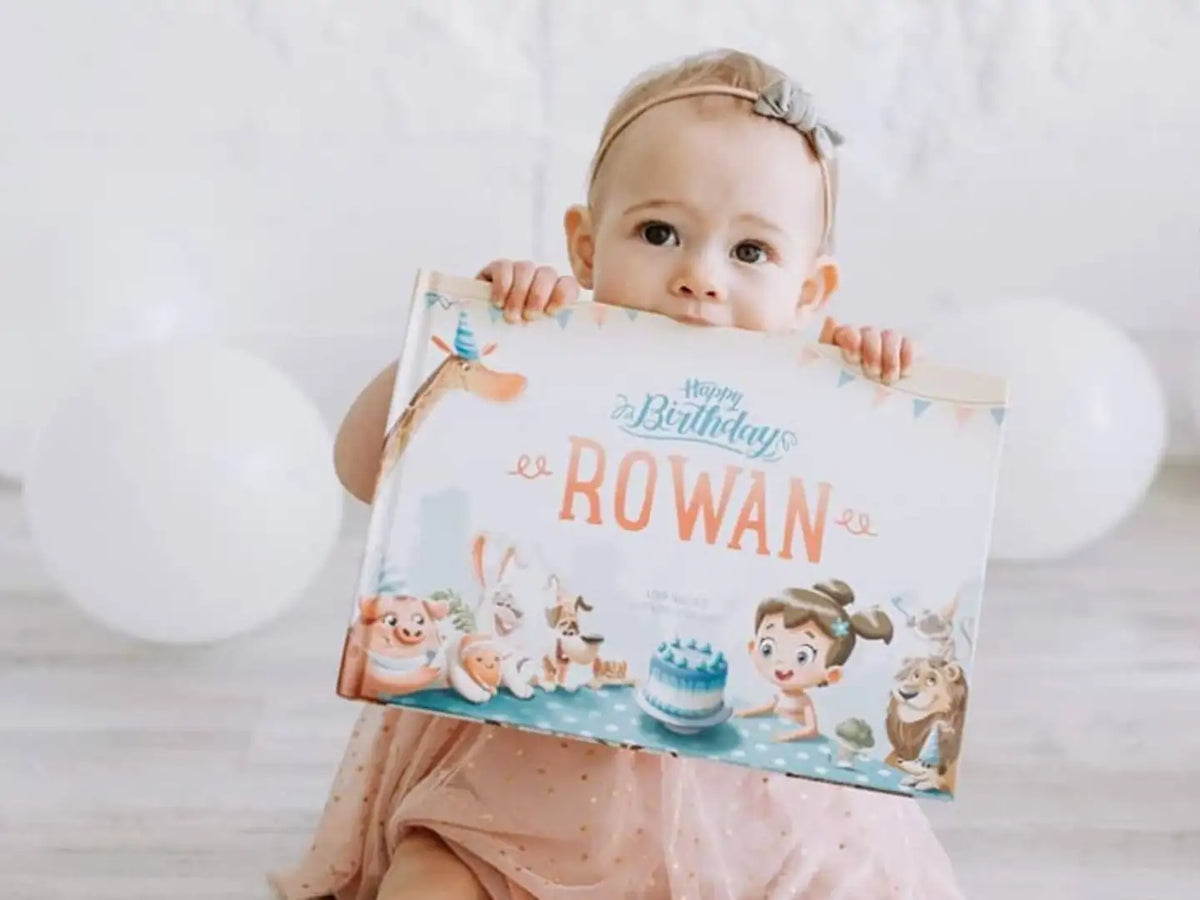 Girl holding the best gift for birthday which is a DIY storybook for a child's birthday.