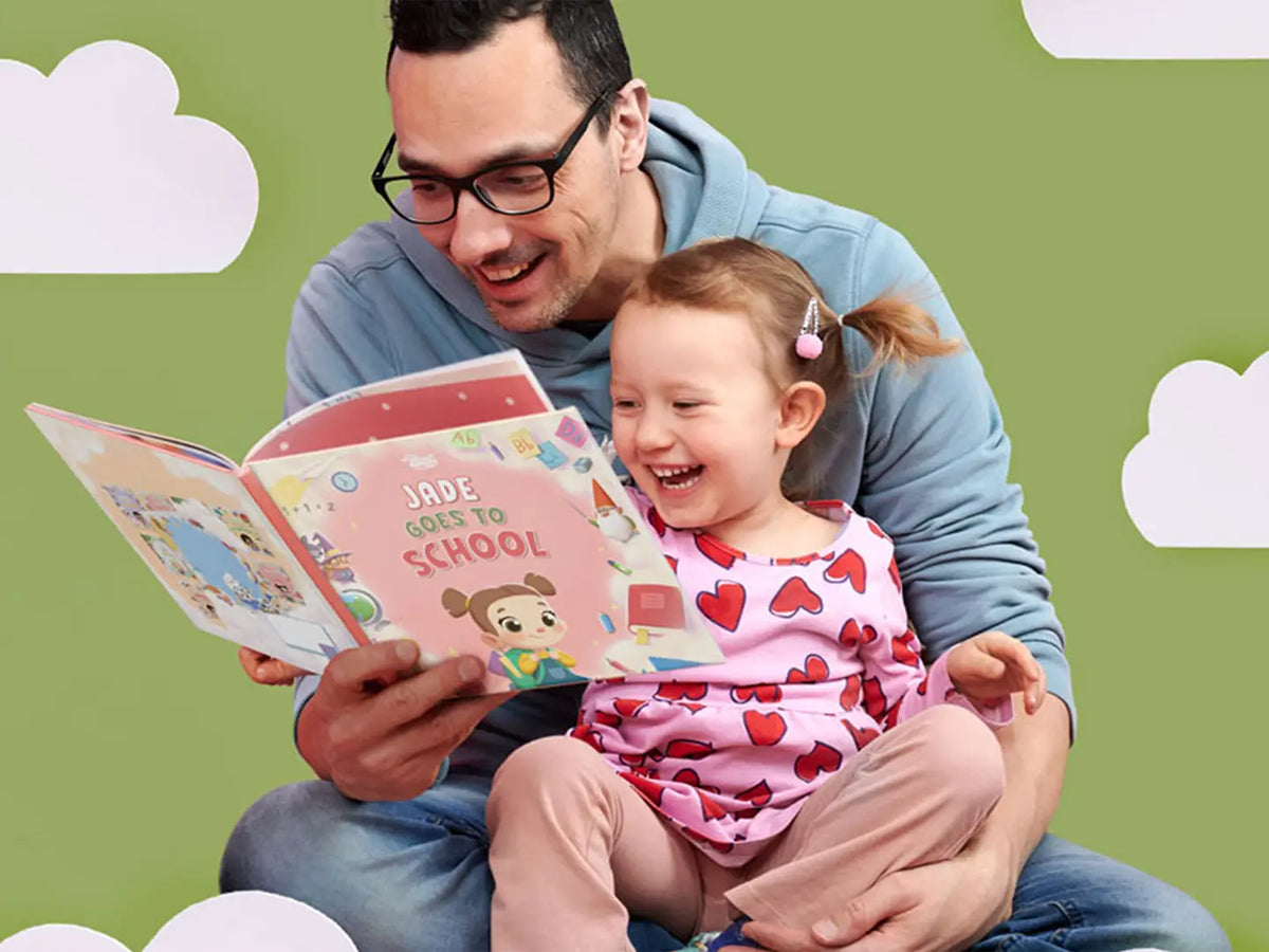 Dad is reading a personalized book about going back to school to his daughter.