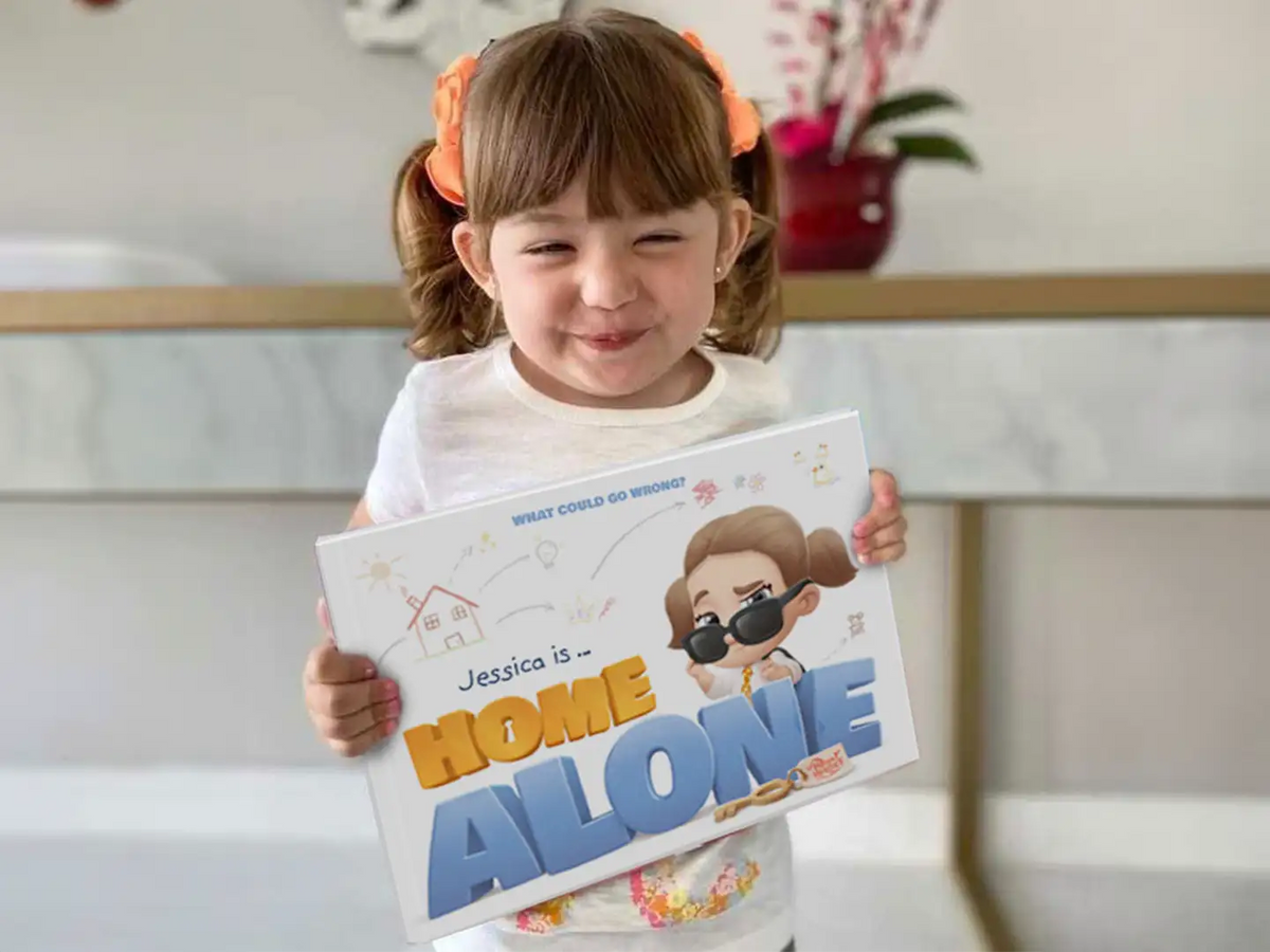 Jessica loves her new custom Jessica is home alone book.