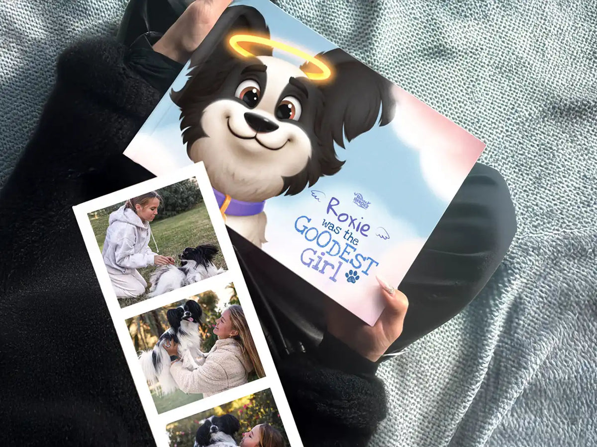 Custom illustrated dog memorial book "Roxie Was the Goodest Girl" by Hooray Heroes shown alongside personal photos of a girl and her dog.
