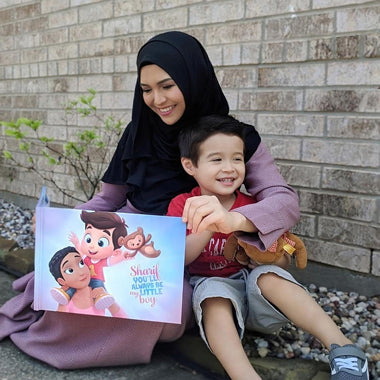 A mother and her son with her Mother's Day gift, a personalized book mommies.