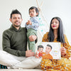 Mom, dad and child giving mommy a special DIY book for Mother's Day from dad and son.