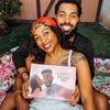 Loving couple cuddling while enjoying their romantic gift which is a personalized book with their names inside the book.