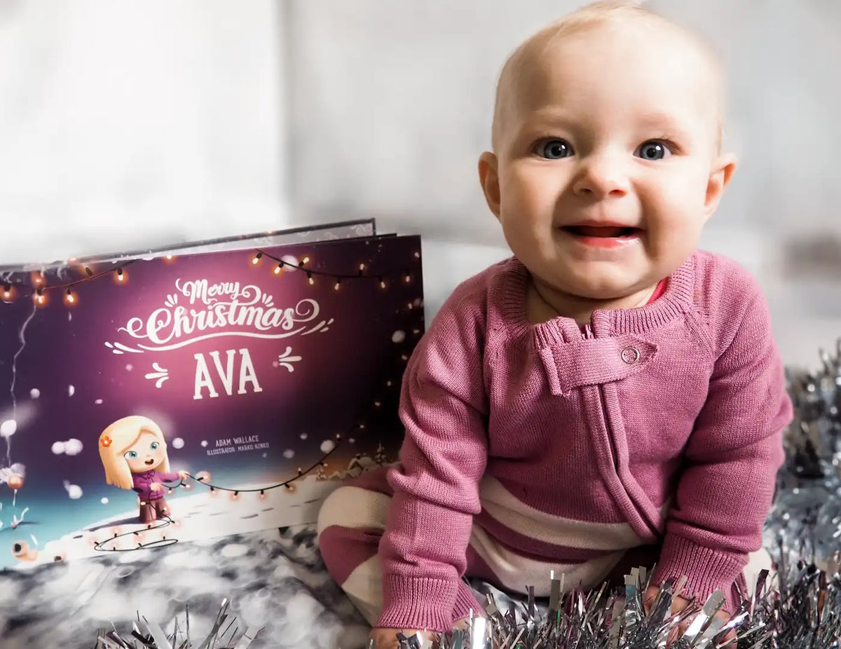 Little girl is happy about her custom Christmas eve book she got as a present.