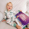 Little Evie is enjoying her personalized Christmas book which is perfect gift for the holidays.