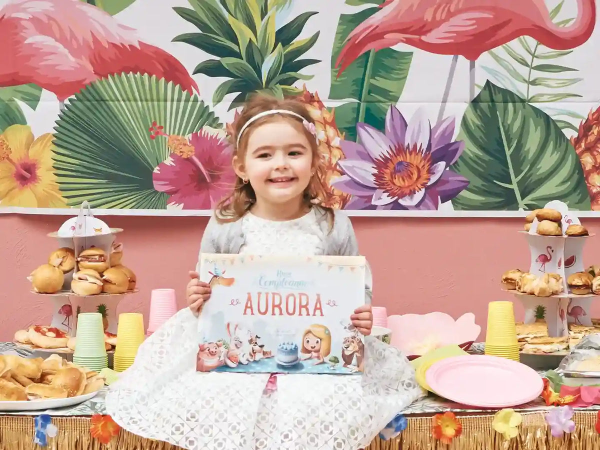 Four-year-old girl is holding her custom birthday book she got for her fourth birthday.