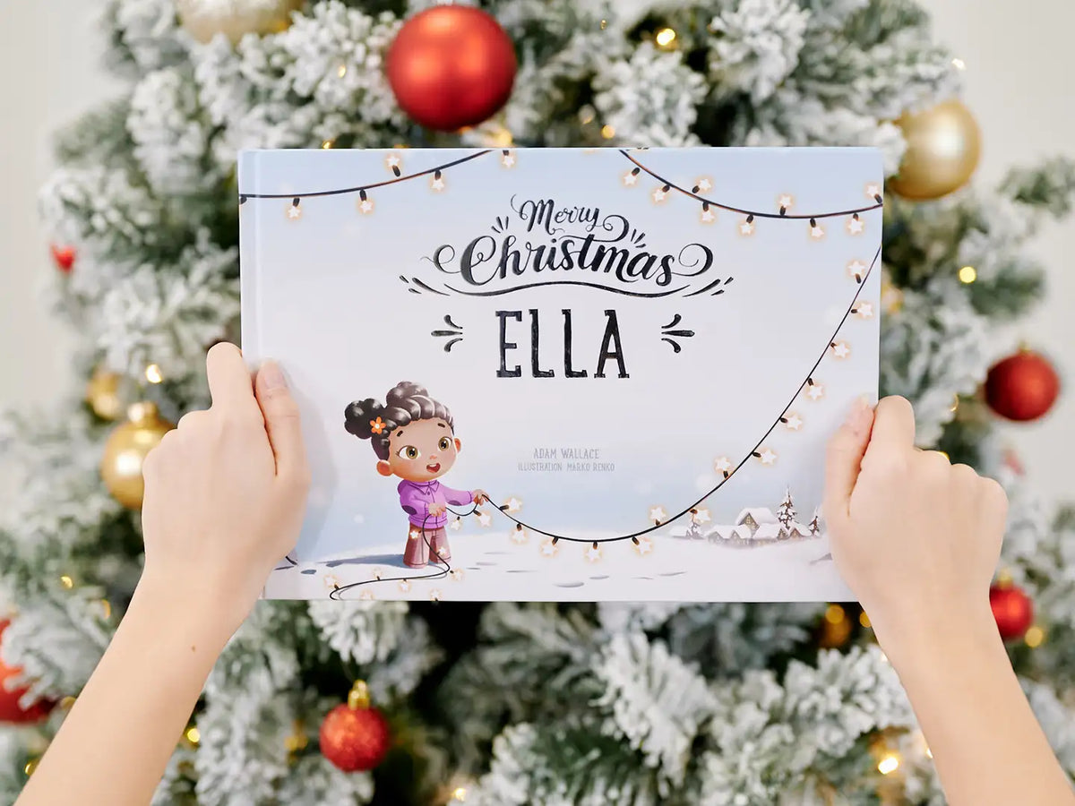 A woman is holding a personalized Christmas book, which is the best gift for kids for Christmas.