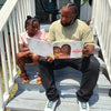 Girl and dad reading a personalized book which is a perfect gift for Father´s Day.