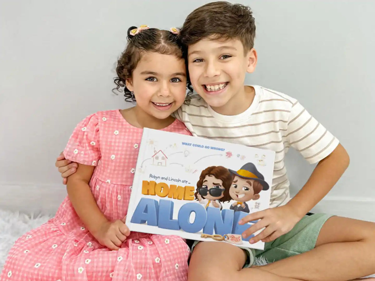 Brother and sister are excited about their new personalized book "Robyn and Lincoln are Home Alone".