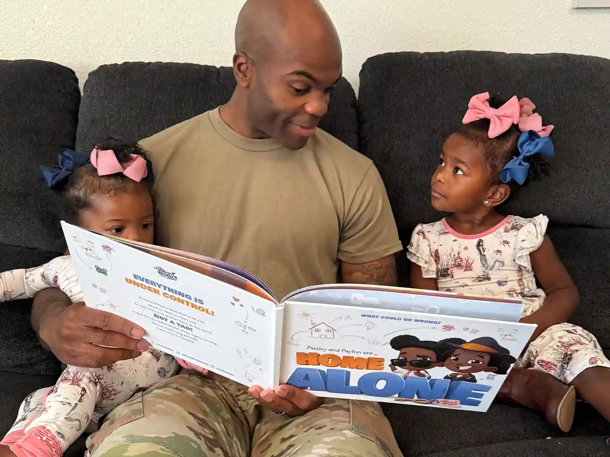 A dad is reading a personalized book about being home alone to his kids.