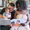 Mommy, daddy and baby read a personalized book they gave mom for Mother's Day.