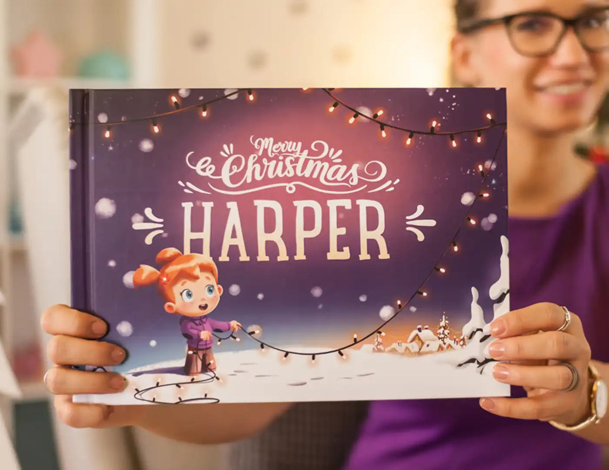 A woman is holding a personalized Christmas book, which is the best gift for kids for Christmas.